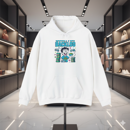 “White hoodie featuring a humorous ‘Stuck in Backlog’ gamer cartoon design, displayed on a stand inside a modern luxury fashion boutique with soft spotlights and premium store decor.”